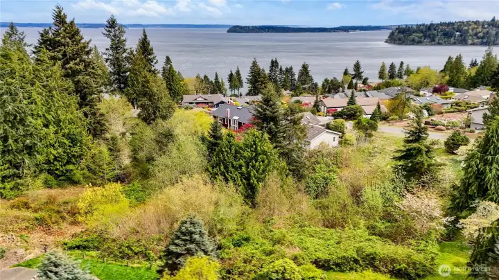 Birds Eye view of water and mountain views surround Port Ludlow Master Planned Resort.
