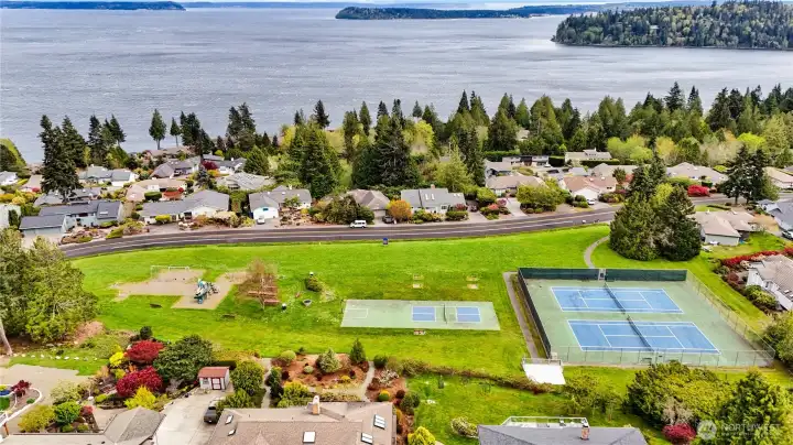 Aerial photo of Kiehle Community Park with tennis courts, play area, picnic benches, and restroom facility.