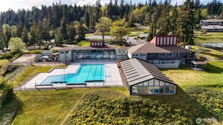 Rear view of Beach Club.  Just to the right is a great area for picnics. Summer times brings residents together to listen and enjoy the sounds of local musicians.