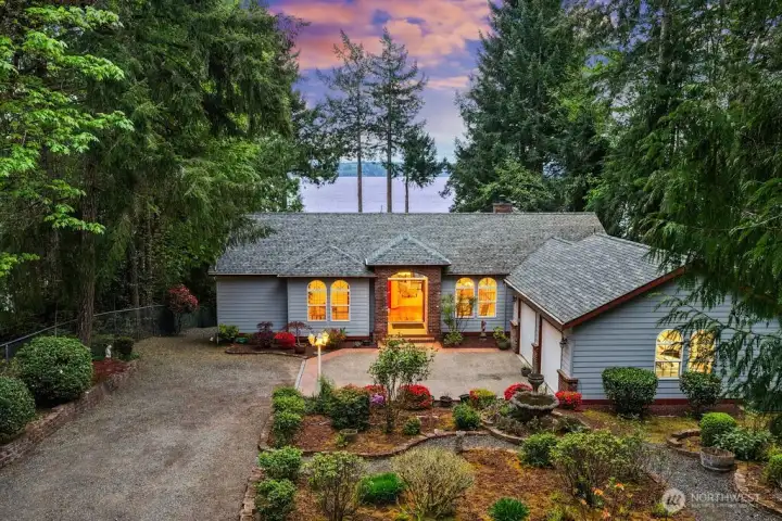 Experience true Pacific NW Waterfront Living in this custom-built retreat set on 1.27 ACRES and 60' waterfront. Thoughtfully designed home offers over 3,700 SQ FT of living space perfectly situated to capture the sweeping views of shimmering Sound, Eagles, Otters, & Whales.  The main floor is flooded with natural light, Primary Bedroom, Additional Guest Bedroom, Expansive Living Room, Formal Dining and Eat-in Kitchen, Laundry, and 720 SQ FT Garage. The deck is the full length of the home with glass panel railing and accessible from french doors in the Primary Bedroom and Kitchen. Fantastic opportunity to host big gatherings!