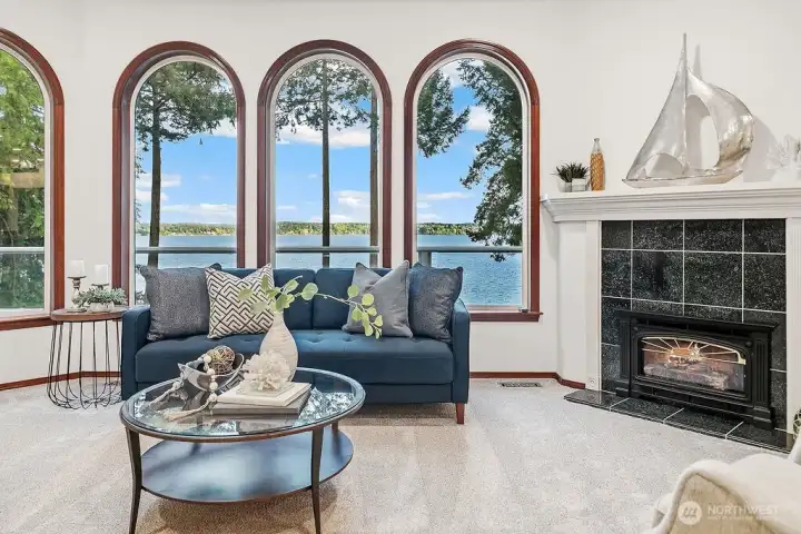 Living Room with gorgeous windows, Gas fireplace, and brand new carpeting.