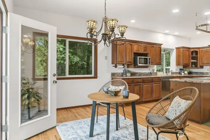 Room for more than one chef in this designer kitchen complete with eat-in area and new freestanding woodstove.