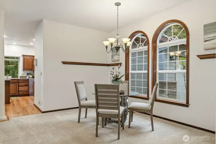 Formal dining area with matching custom windows.