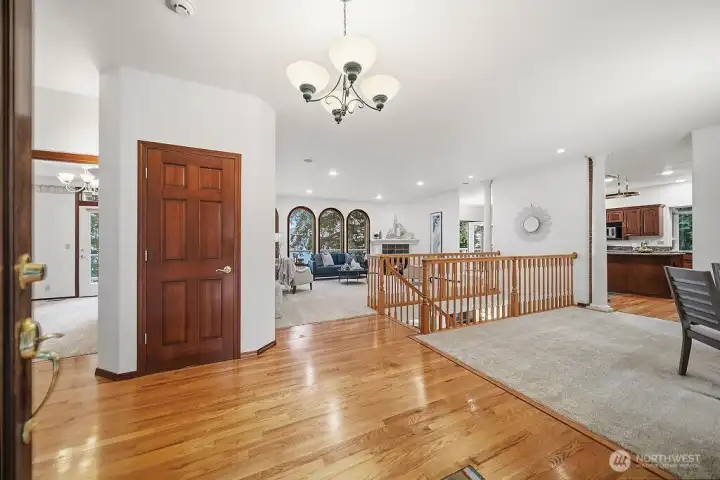 Gleaming hardwood flooring from the entry, to hallway to kitchen.