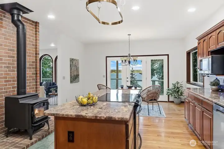 You will want to spend time in this well planned space !  Room for guests to join in~ Enjoy the wood fire, view the deck and water at the Nook area.