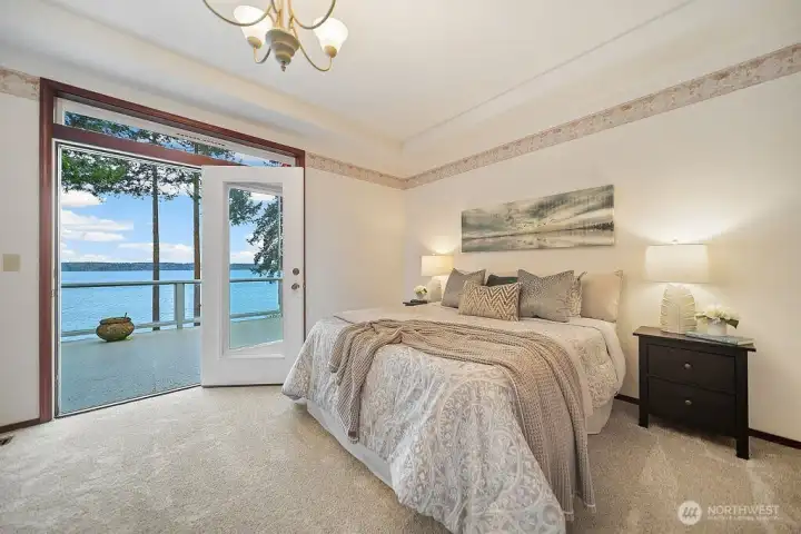 Welcome to this luxurious Primary Bedroom with French Doors to the Deck.