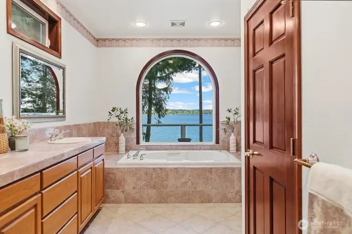 Primary Bedroom is made complete with this 5 piece bath-- Double sinks, separate tiled shower, jetted tub, and a generous walk-in closet!