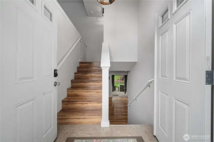 From the moment you step inside, French doors invite you into a bright and welcoming polished home.