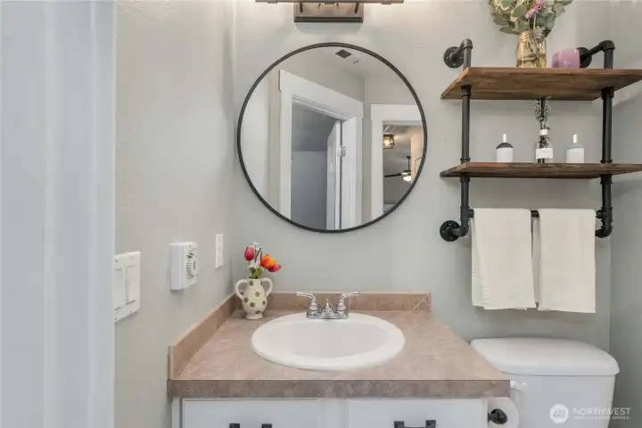 A well-dressed full bath services the two upper bedrooms.