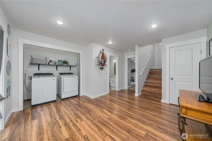 Laundry area is tucked in its own nook for easy access.