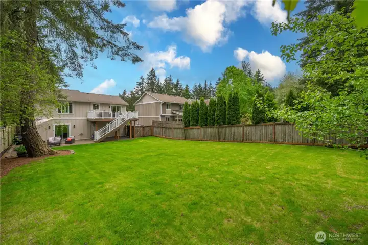 A spectacular back yard fully surrounded by mature trees for the privacy you're looking for.
