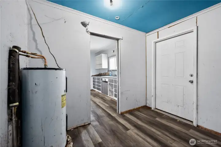 Mud/laundry room with access to carport