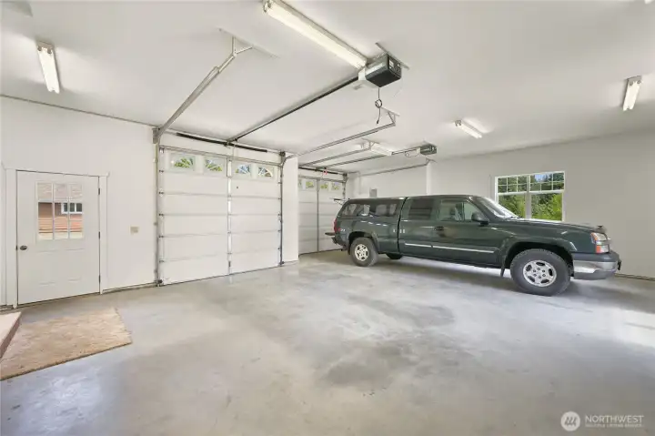 Oversized Attached garage with tall doors. Easily accommodates a full-size pickup with room to spare