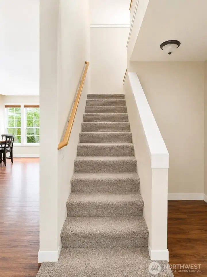Stairs leading to the two bedrooms and two bathrooms on the second floor. Stairs leading to the two bedrooms and two bathrooms on the second floor.