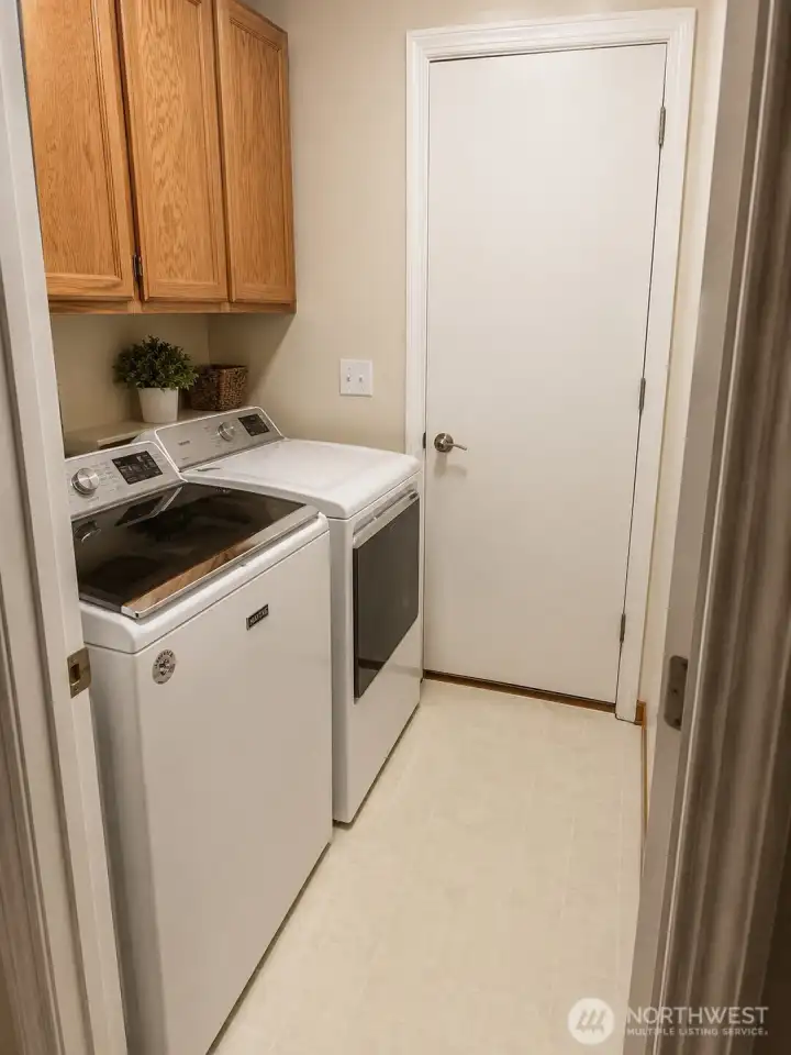Laundry room with fairly new washer and dryer. Laundry room with fairly new washer and dryer.