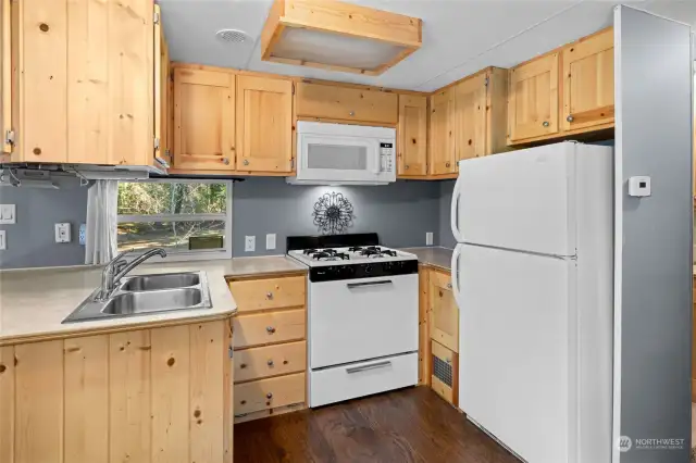 Knotty pine cabinet make-over creates a cozy, country kitchen.