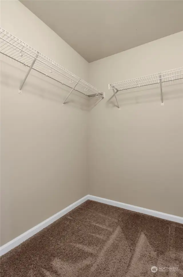 walk in closet in primary bedroom