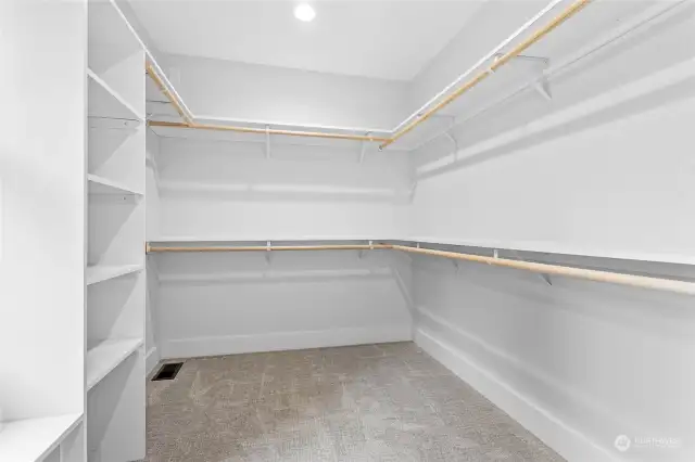 Primary bedroom walk in closet.