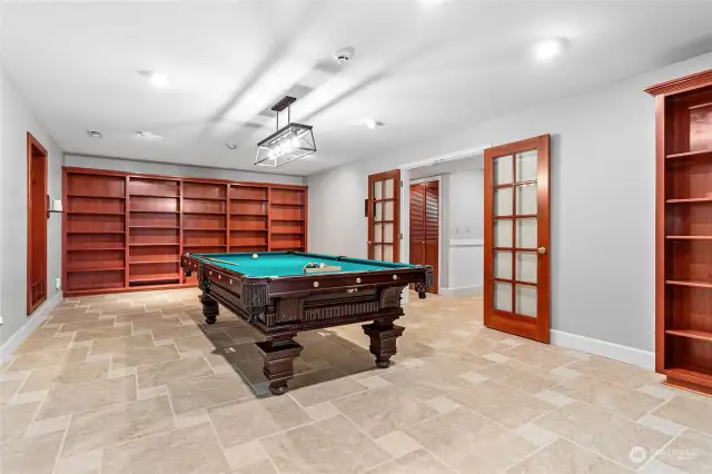 The hidden wine cellar is located behind the Billiard cue stick cabinet at the left of this photo. It features its own mini split to keep the temperature cool.