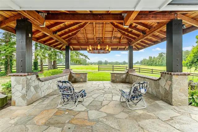 Covered patio area featuring up lights for late evening entertaining.