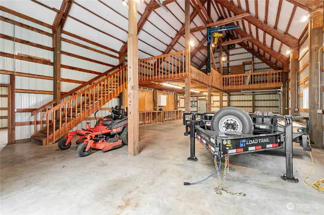 Large shop area with workbench, large loft and a hoist to lift heavy items.