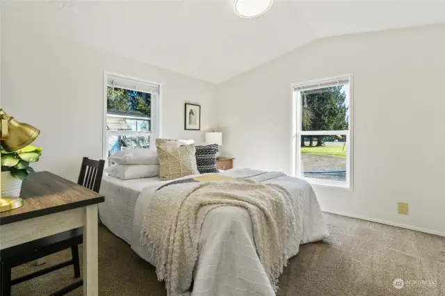 Guest bedroom with vaulted ceilings