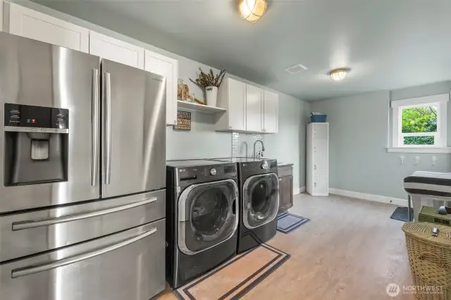 Oversized utility room on the lower floor with extra refrigerator and access to the beach