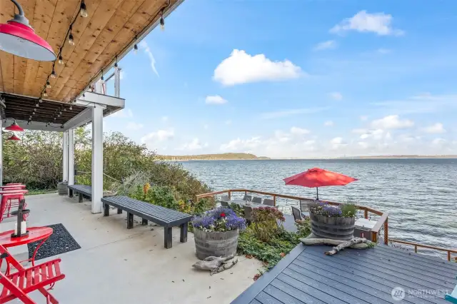 Numerous decks and areas to sit and enjoy the ocean breeze and the view of Seattle and Vashon