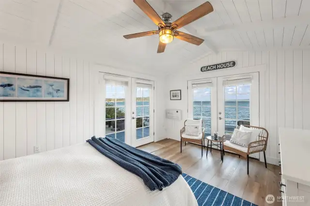 The sweet bedroom has two set of French doors opening to the wrap-around deck