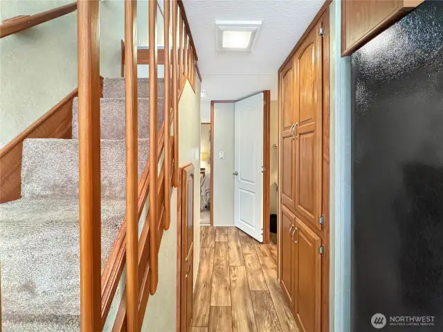 A peek down the hallway toward the bathroom and primary bedroom.