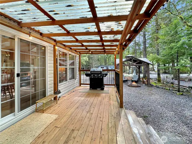 Covered deck adds to the outdoor living space, complete with BBQ.