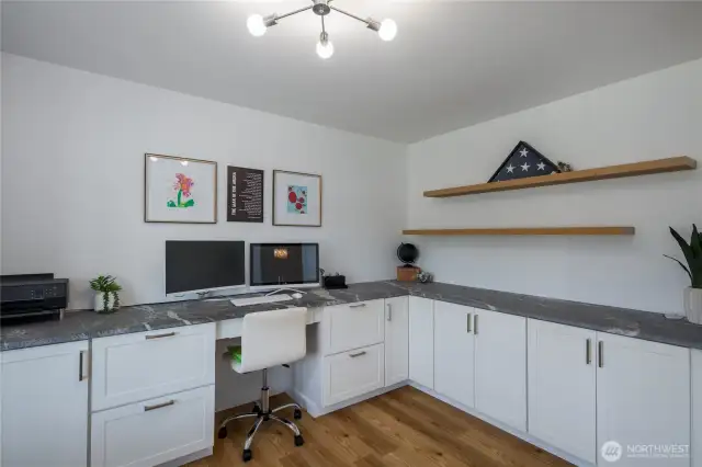 Office with built in cabinets.