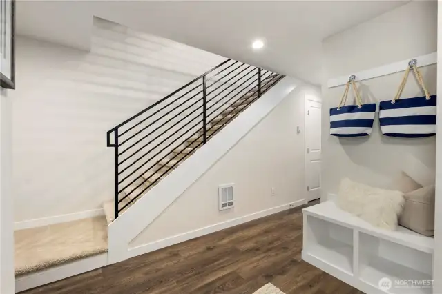 Imagine that....a front foyer!  Features include 2 storage closets, a built in bench with storage, hanging hooks and lots of space to add your personal art and furniture.