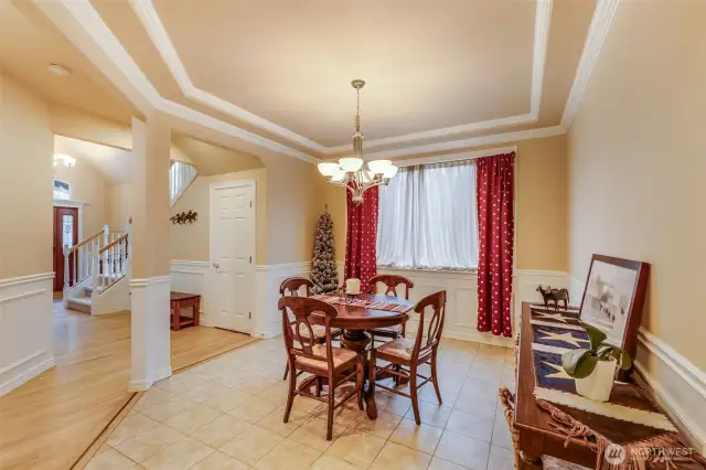 Formal living or dining area. Hardwoods, tiled floors, wainscoting.