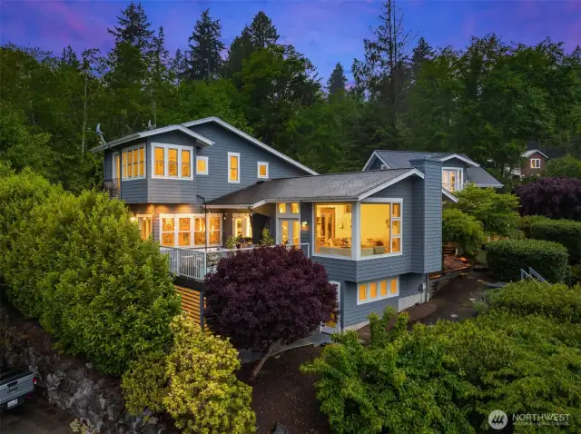Modern architecture with an Island flair. Sited down a private lane on .66 acres with deeded beach access