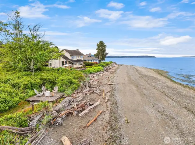 Enjoy this beach platform for chairs, cocktails and nature viewing. The two homes shown are not part of this property or sale.
