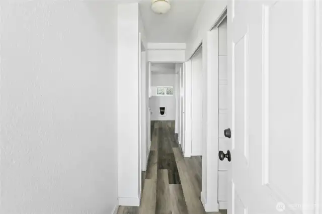 Hallway from back door through the kitchen.