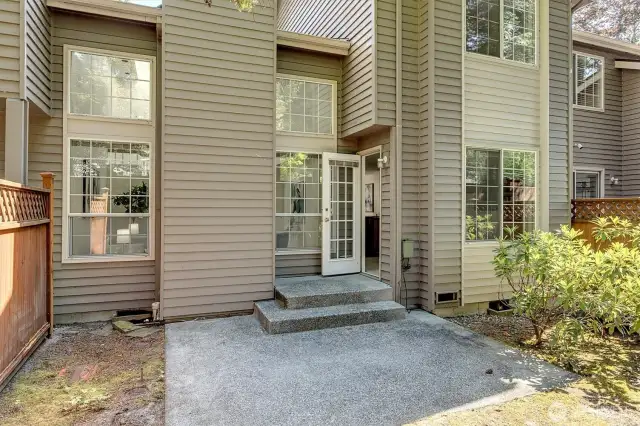 A secluded back patio offers a blank canvas to be creative and personalize.