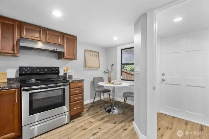 Separate entrance perfect for guests or potential rental income. Love the sweet eating nook!