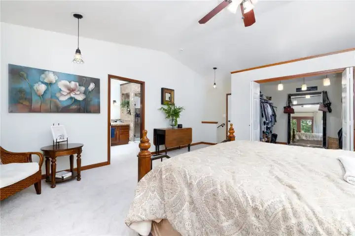 Primary bdr looking at the spacious walk-in closet and entry to the primary bathroom