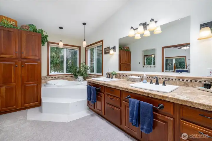 Primary bath with dl sinks, walk-in shower and soaking tub