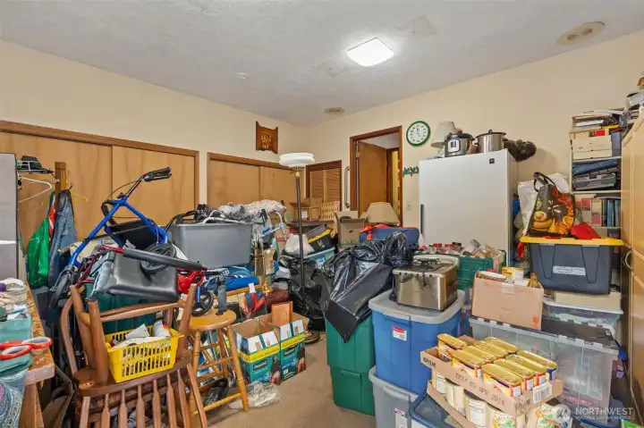 The heirs are in the process of cleaning this room out which was used as a rec room and a bedroom at various times