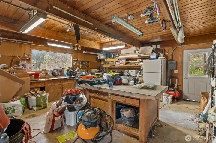 The heirs are in the process of cleaning this out. This is the shop space connected to end of house.