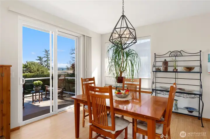 Dining room with a sliding glass door to a deck.