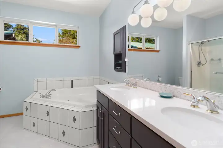 Primary bath has double sinks and a jetted tub, and more.