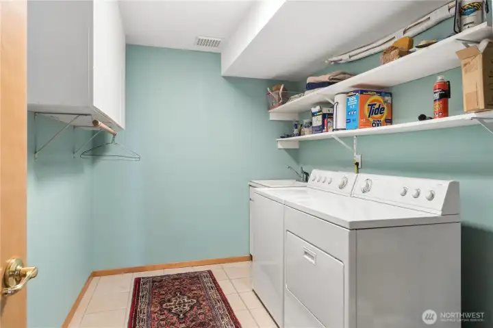 Downstairs is the laundry room and furnace and more storage