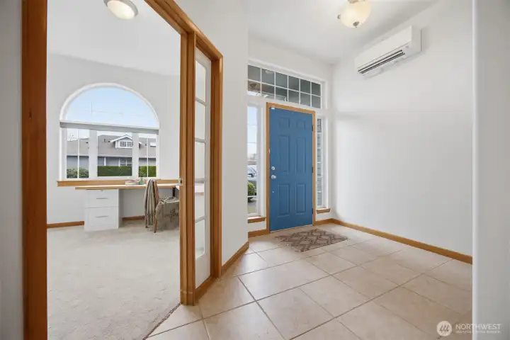 Inside, the tile floor defines the entryway nicely, and there is a lovely office that looks out to the front of the home.
