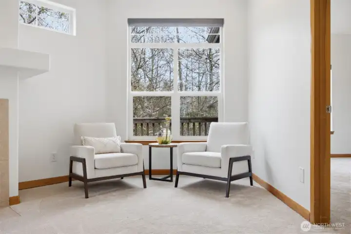 A sitting area to watch nature at the stream beyond the deck.