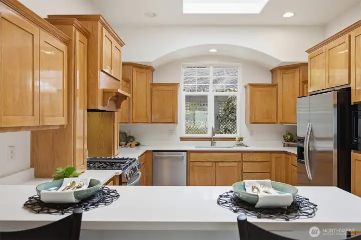 The work triangle is great in this kitchen with an abundance of cabinet storage.