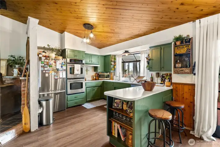 Spacious kitchen with stainless steel appliances.